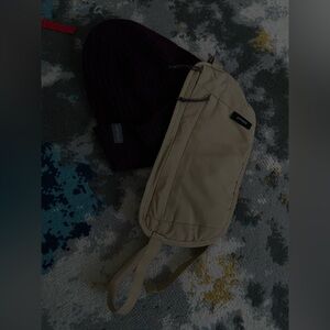 Forclaz bag and purple icebreaker hat